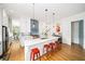 Bright kitchen featuring stainless steel appliances, large island, and red bar stools at 1676 Carroll Nw Dr, Atlanta, GA 30318