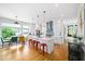 Bright kitchen with an island and stainless steel appliances, adjacent to a dining area at 1676 Carroll Nw Dr, Atlanta, GA 30318