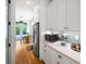 View of the kitchen with stainless steel appliances and a view to the outdoors at 1676 Carroll Nw Dr, Atlanta, GA 30318