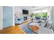 Stylish living room featuring custom built-ins, a cozy fireplace, and comfortable seating arrangement at 1676 Carroll Nw Dr, Atlanta, GA 30318