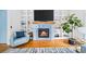 Cozy living room showcases a fireplace, built-in shelving, and comfortable seating area at 1676 Carroll Nw Dr, Atlanta, GA 30318