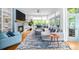 Elegant living room boasting natural light, chic decor, and seamless flow to the outdoor areas at 1676 Carroll Nw Dr, Atlanta, GA 30318