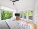 Bright main bedroom with vaulted ceiling and large windows overlooking a private deck and wooded area at 1676 Carroll Nw Dr, Atlanta, GA 30318