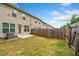 A fenced backyard showing the patio and the privacy fence at 2142 Arnage Dr, Lithonia, GA 30058