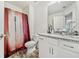 A cozy bathroom features a vanity with granite counter, a toilet, and a tub with shower at 2142 Arnage Dr, Lithonia, GA 30058