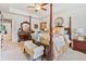The expansive primary suite has carpeted floors, sitting bench, and classic furnishings at 2142 Arnage Dr, Lithonia, GA 30058