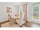 Bright dining area features a round table and view of the backyard at 2142 Arnage Dr, Lithonia, GA 30058