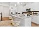 Bright kitchen features stainless appliances, granite counters, and island with seating at 2142 Arnage Dr, Lithonia, GA 30058