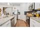 Stylish kitchen features stainless appliances, granite counters, and herringbone backsplash at 2142 Arnage Dr, Lithonia, GA 30058