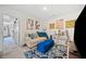 Inviting living room with a comfy sofa, stylish ottoman, decorative art, and a glimpse into another room at 2142 Arnage Dr, Lithonia, GA 30058