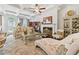 Elegant living room with coffered ceilings, fireplace, and ample natural light at 2142 Arnage Dr, Lithonia, GA 30058