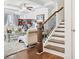 Cozy living room featuring hardwood floors, stairs, and stylish furniture at 2142 Arnage Dr, Lithonia, GA 30058
