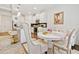 Open concept living space with kitchen, dining area, and island seating at 2142 Arnage Dr, Lithonia, GA 30058