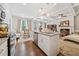 Open concept living space featuring gourmet kitchen and elegant living room with fireplace at 2142 Arnage Dr, Lithonia, GA 30058