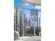 Stunning city views seen through large windows, offering an urban oasis with natural light at 222 12Th Ne St # 1806, Atlanta, GA 30309