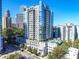 Stunning exterior shot of a high-rise condominium building with a pool and cityscape views at 222 12Th Ne St # 1806, Atlanta, GA 30309