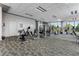Spacious gym with cardio machines, free weights, and ample natural light at 222 12Th Ne St # 1806, Atlanta, GA 30309