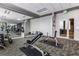 Modern gym featuring weightlifting equipment, mirrors, and an exit to a hall at 222 12Th Ne St # 1806, Atlanta, GA 30309