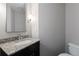 Modern half-bathroom with granite countertops and a contemporary design at 222 12Th Ne St # 1806, Atlanta, GA 30309