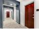A view down a residential hallway with carpet and grey trim at 222 12Th Ne St # 1806, Atlanta, GA 30309