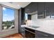 Modern kitchen offering stainless appliances and a beautiful city view through the window at 222 12Th Ne St # 1806, Atlanta, GA 30309