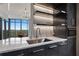 Well-lit kitchen with modern fixtures, marble countertops, sleek cabinetry, and beautiful outdoor views at 222 12Th Ne St # 1806, Atlanta, GA 30309