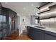Stylish kitchen with modern appliances, a wine cooler, and white marble backsplash, offering city views at 222 12Th Ne St # 1806, Atlanta, GA 30309