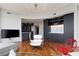Modern living room featuring sleek design, hardwood floors, and a stylish bar area with marble accents at 222 12Th Ne St # 1806, Atlanta, GA 30309