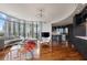 Open living space with a sleek kitchen, hardwood floors, and curved floor-to-ceiling windows offers city views at 222 12Th Ne St # 1806, Atlanta, GA 30309