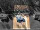 An aerial view showcasing the property layout, landscaping, and surrounding wooded area at 427 Oscar Ct, Mcdonough, GA 30252
