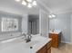 Bathroom with double sink vanity, soaking tub, and separate glass shower at 427 Oscar Ct, Mcdonough, GA 30252