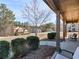 Inviting covered front porch with seating area, offering a relaxing outdoor space at 427 Oscar Ct, Mcdonough, GA 30252
