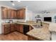 Open kitchen featuring granite countertops, wooden cabinets, and stainless steel appliances at 427 Oscar Ct, Mcdonough, GA 30252
