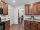 Kitchen with wood cabinets, granite counters and stainless ice maker with hardwood floors at 427 Oscar Ct, Mcdonough, GA 30252