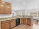 Kitchen featuring granite countertops, wood cabinets, and stainless steel dishwasher at 427 Oscar Ct, Mcdonough, GA 30252