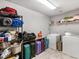 Functional laundry area with washer, dryer, and shelving for storage at 427 Oscar Ct, Mcdonough, GA 30252