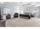 Spacious main bedroom with tray ceiling, sitting area, and neutral tones at 427 Oscar Ct, Mcdonough, GA 30252