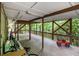 Covered back porch featuring wood flooring, railing, and ceiling lights at 4754 Kelley Se Ct, Mableton, GA 30126