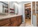 Elegant bathroom with dual vanities, granite countertops, and access to a walk-in closet at 4754 Kelley Se Ct, Mableton, GA 30126