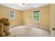 The bright bedroom has two windows with green trees outside at 4754 Kelley Se Ct, Mableton, GA 30126