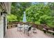 Outdoor deck featuring a seating area and offering a relaxing space surrounded by mature trees and greenery at 4754 Kelley Se Ct, Mableton, GA 30126