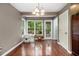 Dining room featuring hardwood floors, a modern chandelier, and lots of natural light at 4754 Kelley Se Ct, Mableton, GA 30126