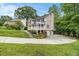 Charming home with a stone and siding exterior, white pergola, well-maintained lawn and three-car garage at 4754 Kelley Se Ct, Mableton, GA 30126