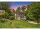 Traditional home with a stone facade, inviting front porch, manicured lawn and colorful sunset at 4754 Kelley Se Ct, Mableton, GA 30126