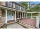 Charming two-story home with a welcoming front porch, blue door and well-maintained landscaping at 4754 Kelley Se Ct, Mableton, GA 30126