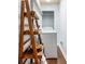 Laundry room featuring laundry machine, shelving and hardwood floors at 4754 Kelley Se Ct, Mableton, GA 30126