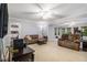 Spacious living room with neutral colors, carpet, multiple windows, and open access to dining area at 4754 Kelley Se Ct, Mableton, GA 30126