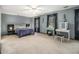 Serene main bedroom boasts natural light and a dressing table, creating a calming retreat within the home at 4754 Kelley Se Ct, Mableton, GA 30126
