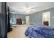 Large main bedroom with ceiling fan, carpeted floor, and adjoining bathroom at 4754 Kelley Se Ct, Mableton, GA 30126