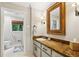 Bright bathroom featuring a vanity with storage and a linen closet for optimal organization at 1050 Mountain Creek Trl, Atlanta, GA 30328